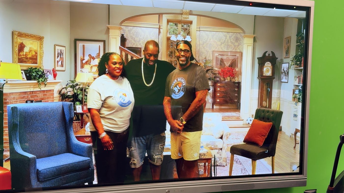 Killer Mike at the MBV booth with puppets and event signage